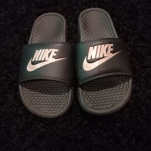 Black and rose gold Nike slides